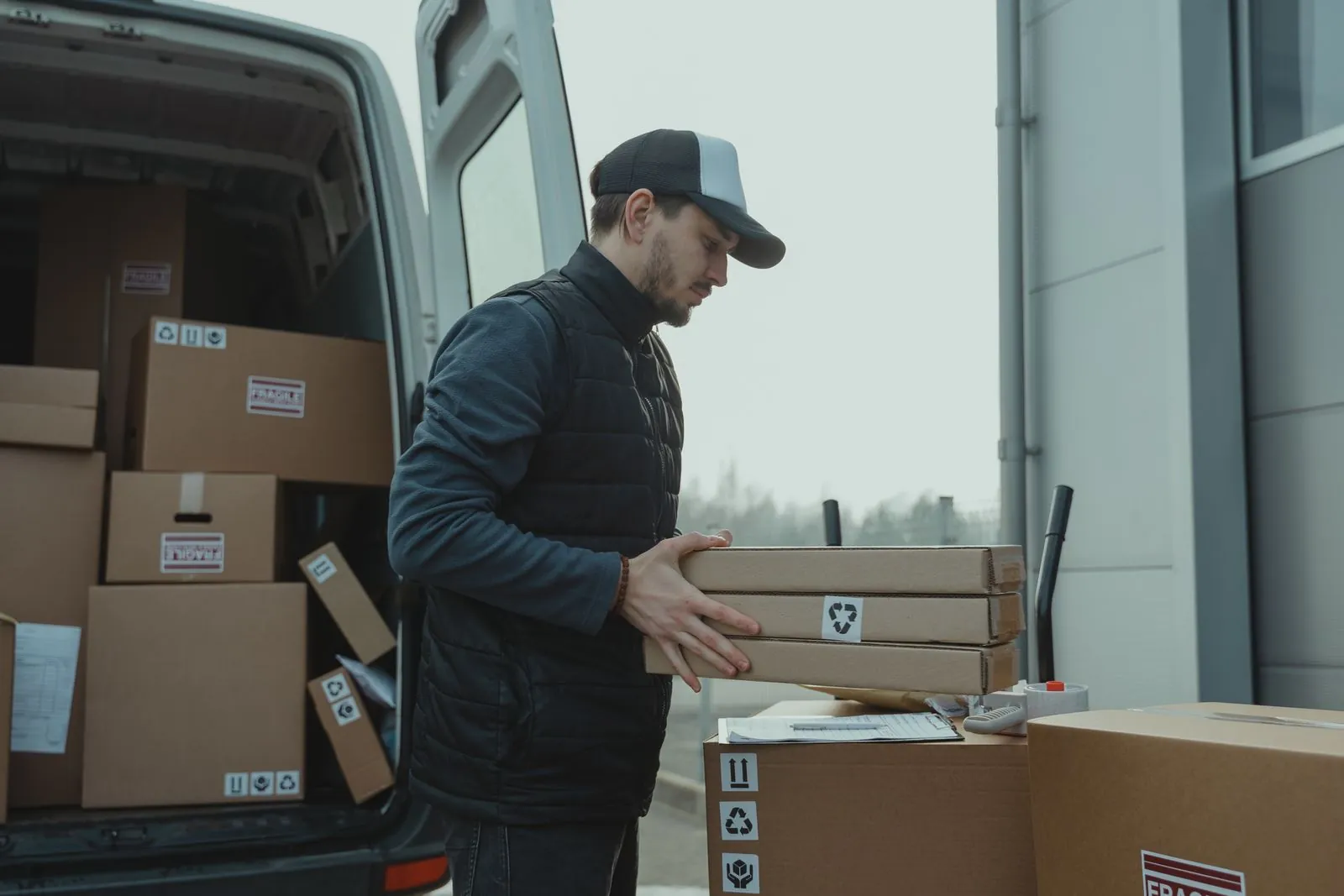 mover loading boxes into a van on a short-notice job